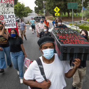 Protesters leave coffins on councilwoman’s lawn as city debates final budget