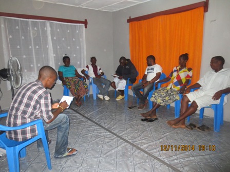 Hindo briefing his team about strategies to fight Ebola - Courtesy Photo