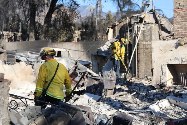 Firefighters search through the rubble of an Altadena property destroyed in the Eaton Fire.