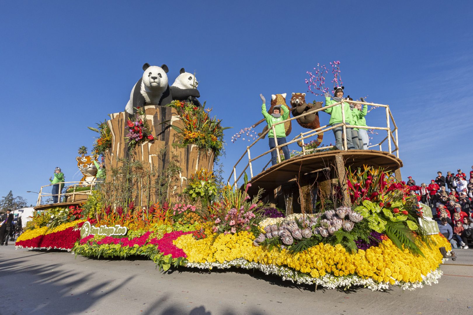 The top-honored float in the 2025 Rose Parade depicts the San Diego Zoo's new giant pandas and San Diego Zoo Wildlife Alliance team members Megan Owen and Jana Biedenweg and global conservationist Xiaoxing Bian.