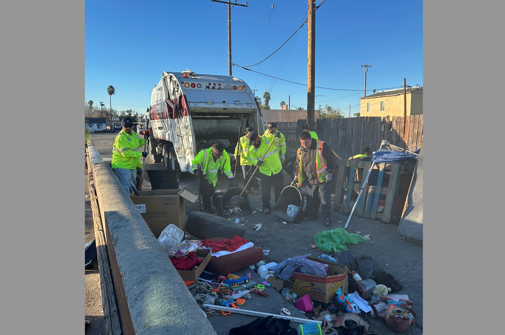 A crew clears an encampment from an alley near Baseline and D streets.