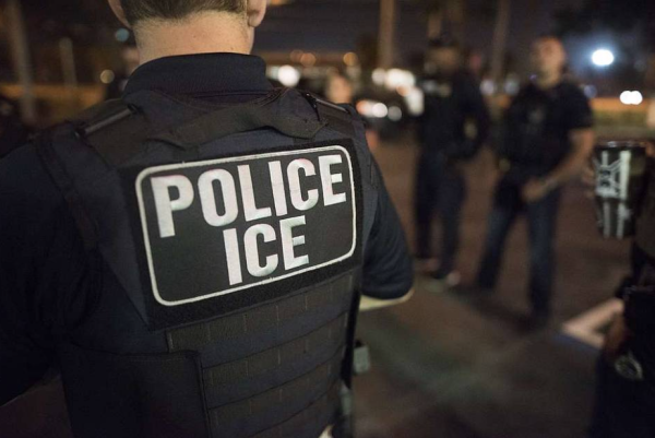 An ICE officer participates in a 2018 enforcement operation.