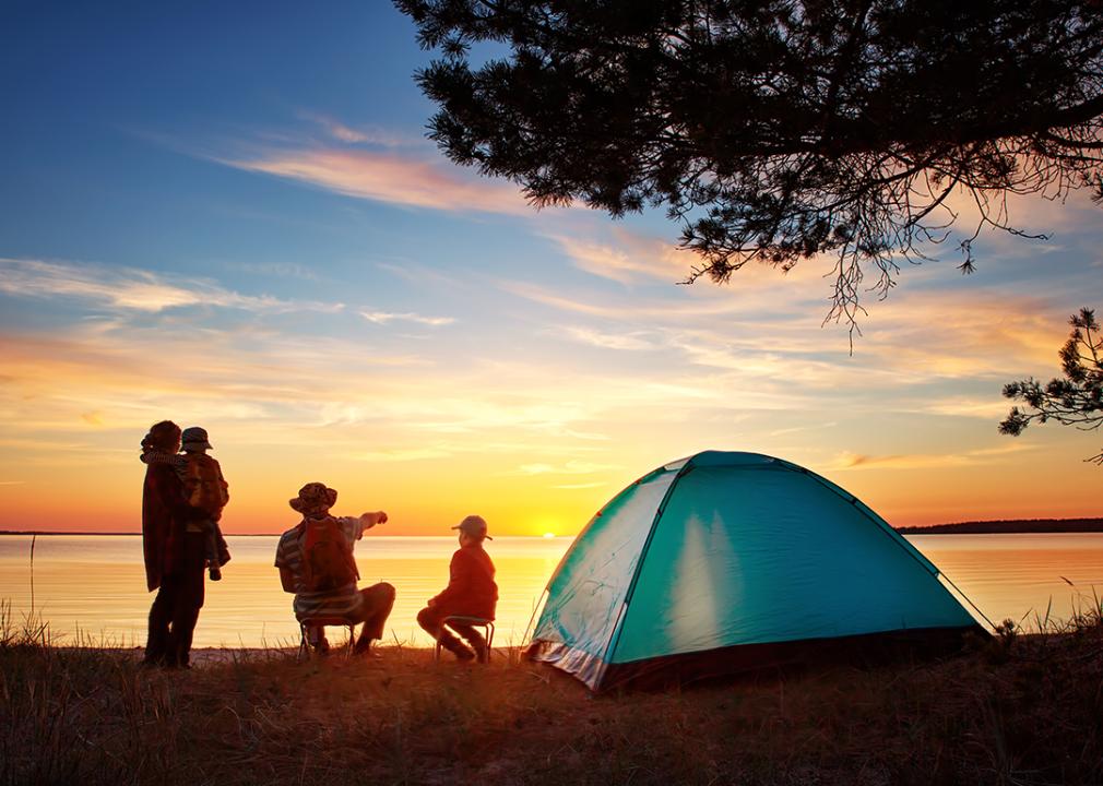 Campers enjoy a sunset view.