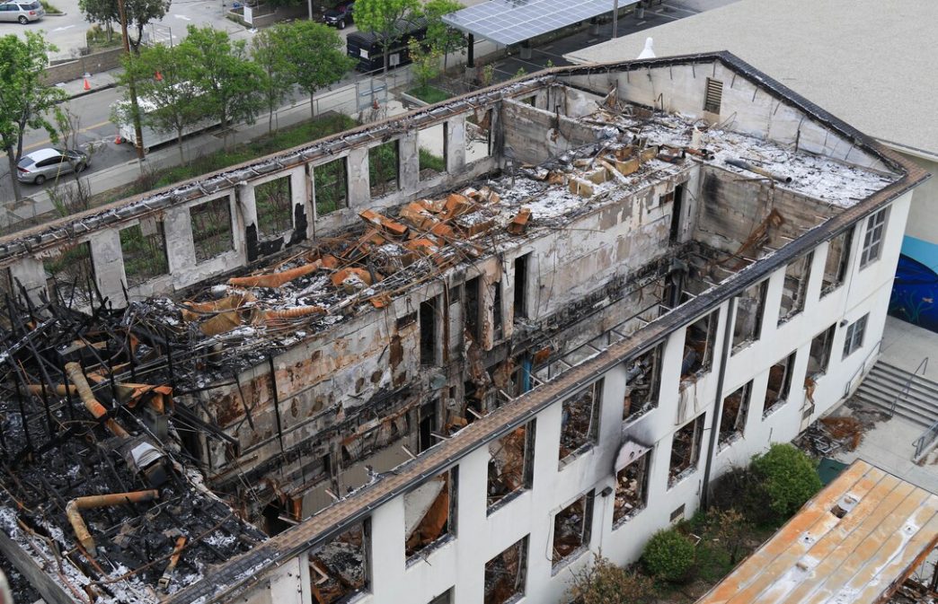 The Eaton Fire leaves the auditorium on the Altadena campus of Eliot Arts Magnet in ruins.