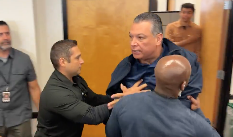 Federal agents push U.S. Sen. Alex Padilla, D-California, out of a Homeland Security press briefing in West LA.