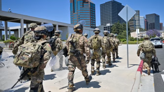 Federalized California National Guard soldiers walk through downtown LA in June.