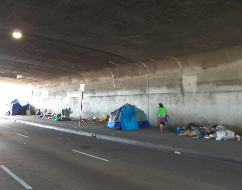 Freeway overpasses are common sites for homeless encampments.