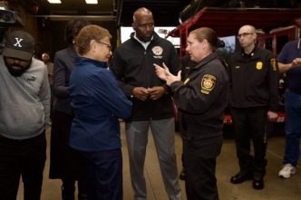 Then-LA Fire Chief Kristin Crowley, second from right, discusses rainstorm preparation with Mayor Karen Bass and city officials in February.