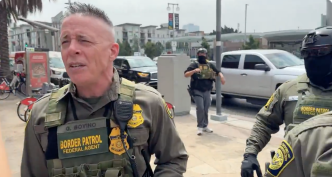 U.S. Border Patrol Section Commander Gregory Bovino speaks to reporters in downtown LA near where Gov. Gavin Newsom and local officials were holding a news conference.