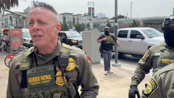 U.S. Border Patrol Section Commander Gregory Bovino speaks to reporters in downtown LA near where Gov. Gavin Newsom and local officials were holding a news conference.
