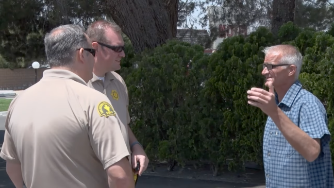 Kevin Bourke speaks with San Bernardino County sheriff's deputies.