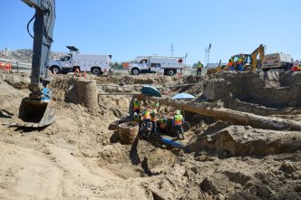 DWP workers dig deep in order to restore water to over 9,200 customers in the San Fernando Valley.