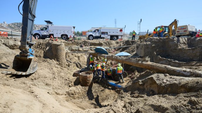 DWP workers dig deep in order to restore water to over 9,200 customers in the San Fernando Valley.
