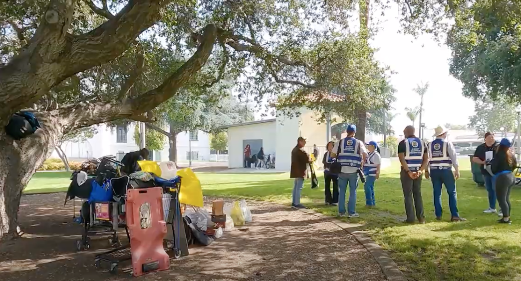 An LA County outreach team speaks with a veteran experiencing homelessness in Monrovia in 2024.