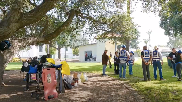 An LA County outreach team speaks with a veteran experiencing homelessness in Monrovia in 2024.