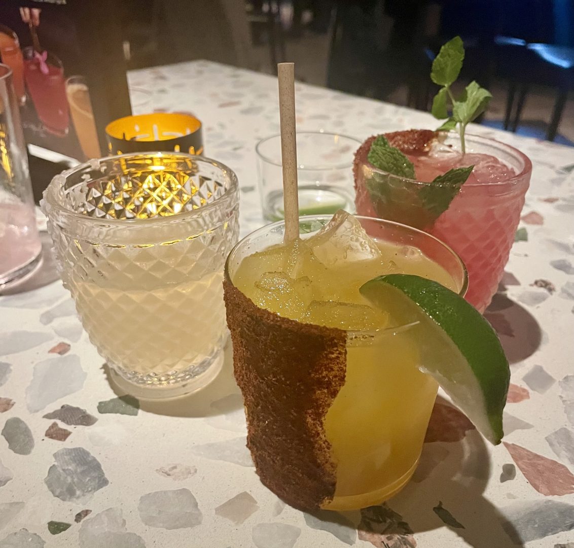 A flight of margaritas: from left to right, the LP margarita, the chile pineapple mango margarita, and the watermelon hibiscus margarita.