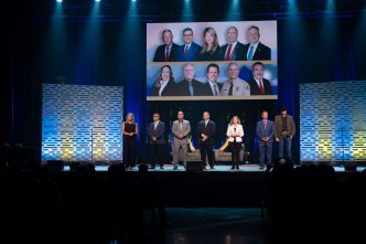 San Bernardino County officials assemble on the Ontario Convention Center stage during this year's State of the County event.