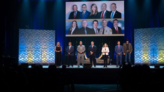 San Bernardino County officials assemble on the Ontario Convention Center stage during this year's State of the County event.