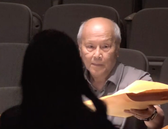 Arcadia resident Benny Yee hands documents to City Clerk Linda Rodriguez as he serves the city with a lawsuit over the council's censure of Mayor Sharon Kwan.