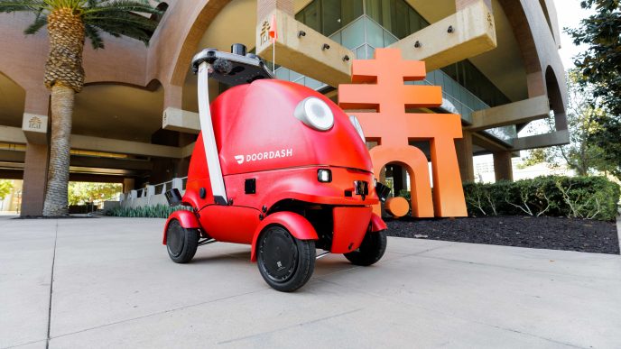 A DoorDash delivery robot arrives at Riverside City Hall.