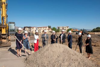 Local officials ceremoniously start construction on Adler Square affordable housing.
