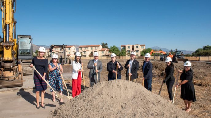 Local officials ceremoniously start construction on Adler Square affordable housing.