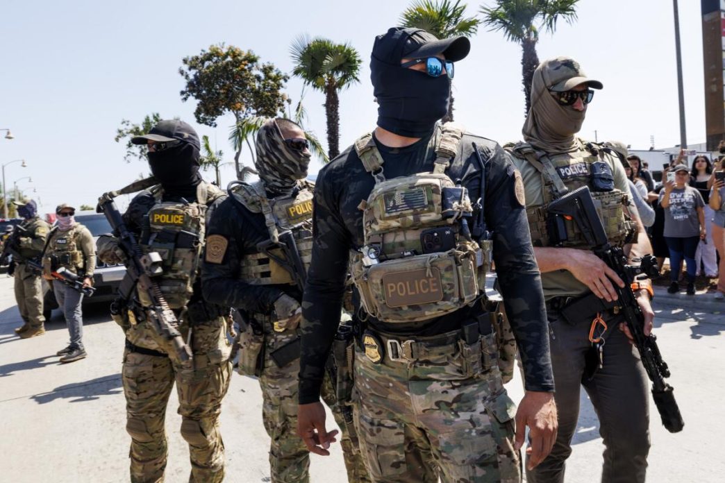 Masked immigration enforcement agents operate in the Los Angeles area.