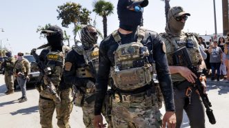 Masked immigration enforcement agents operate in the Los Angeles area.