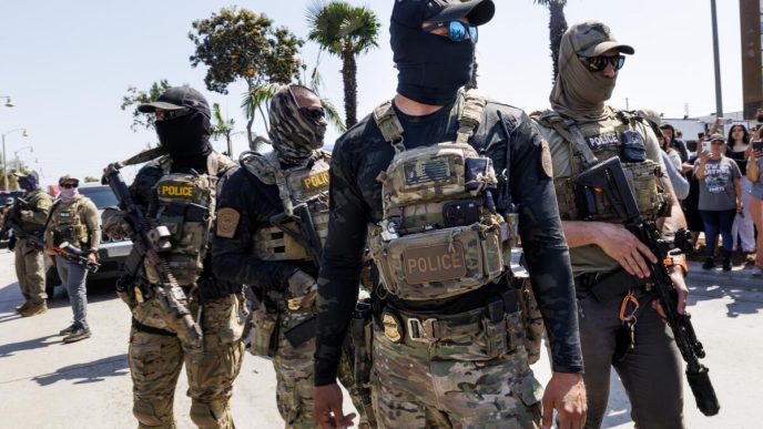 Masked immigration enforcement agents operate in the Los Angeles area.