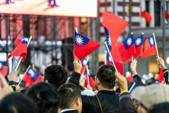 Taiwan flags wave at a rally.