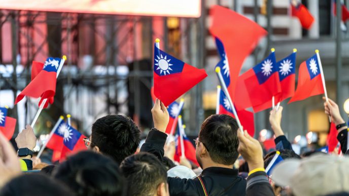 Taiwan flags wave at a rally.
