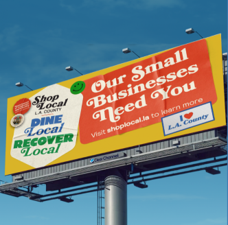 A billboard advertises the county's Shop Local. Dine Local. Recover Local. Campaign.
