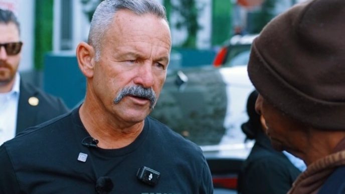 Riverside County Sheriff Chad Bianco speaks with an unidentified Angeleno during his tour through homeless encampments on Skid Row in downtown Los Angeles.