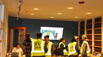 Volunteers check in at the start of the annual point-in-time count to assess unsheltered homelessness in the Los Angeles area.