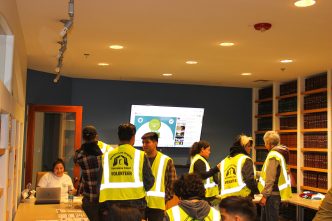 Volunteers check in at the start of the annual point-in-time count to assess unsheltered homelessness in the Los Angeles area.
