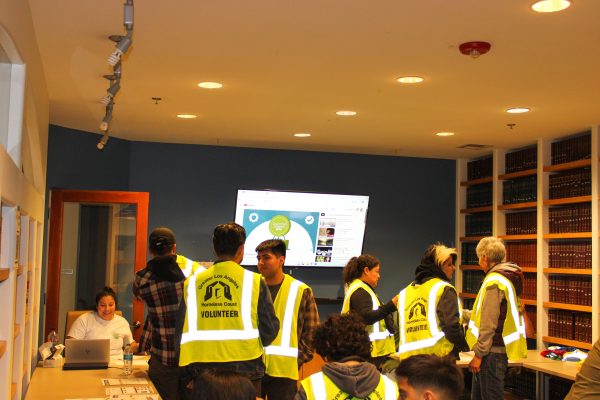 Volunteers check in at the start of the annual point-in-time count to assess unsheltered homelessness in the Los Angeles area.