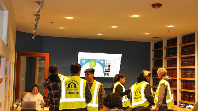 Volunteers check in at the start of the annual point-in-time count to assess unsheltered homelessness in the Los Angeles area.