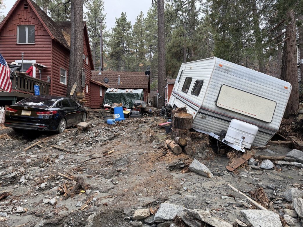 A residence in San Bernardino County shows visible damage from flooding, mud and debris following severe winter storms.