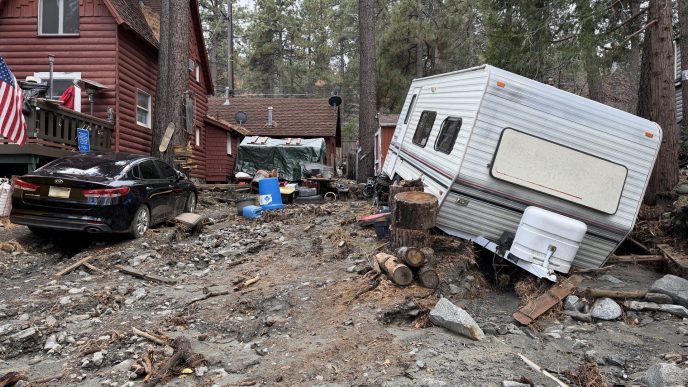 A residence in San Bernardino County shows visible damage from flooding, mud and debris following severe winter storms.