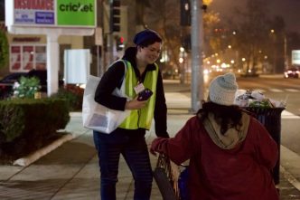 A volunteer speaks with a Pasadena resident experiencing homelessness during the city's 2026 homelessness count.