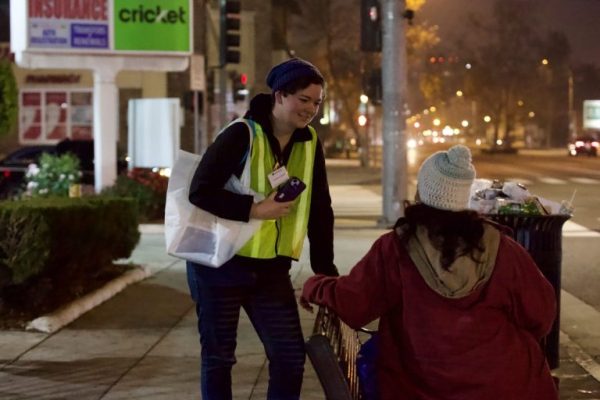 A volunteer speaks with a Pasadena resident experiencing homelessness during the city's 2026 homelessness count.