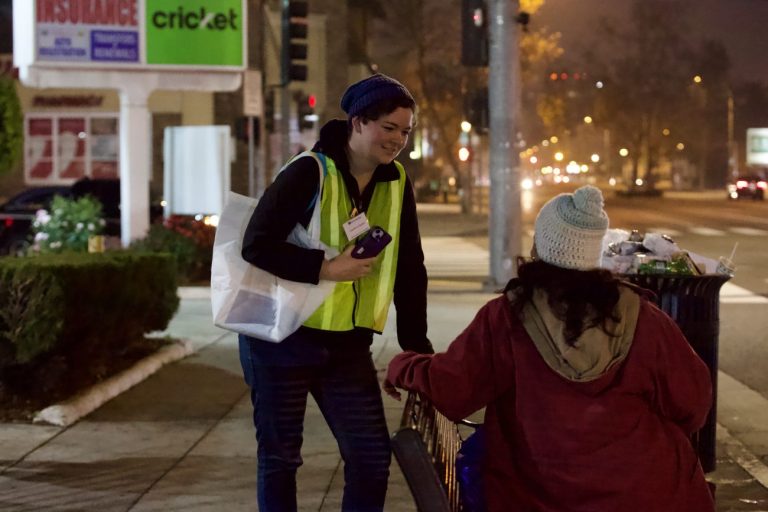 A volunteer speaks with a Pasadena resident experiencing homelessness during the city's 2026 homelessness count.