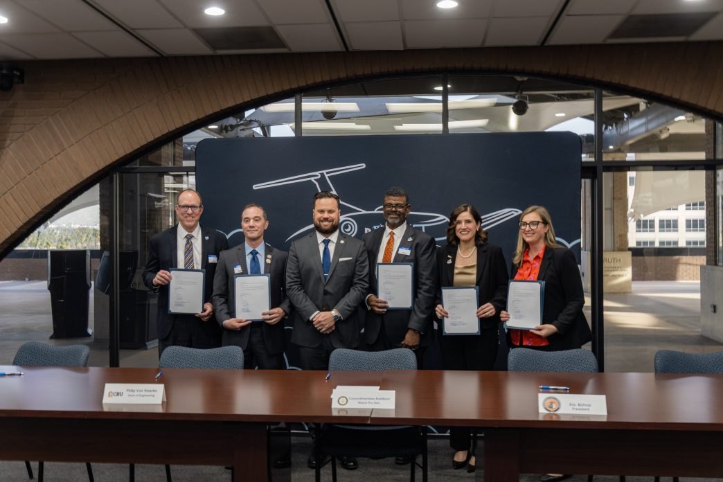 Riverside officials and local educators celebrate the launch of the Learning Institute for Flight Technology.