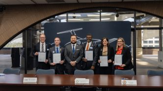 Riverside officials and local educators celebrate the launch of the Learning Institute for Flight Technology.