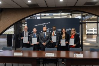 Riverside officials and local educators celebrate the launch of the Learning Institute for Flight Technology.