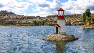 A lighthouse sits on a small island in Canyon Lake.
