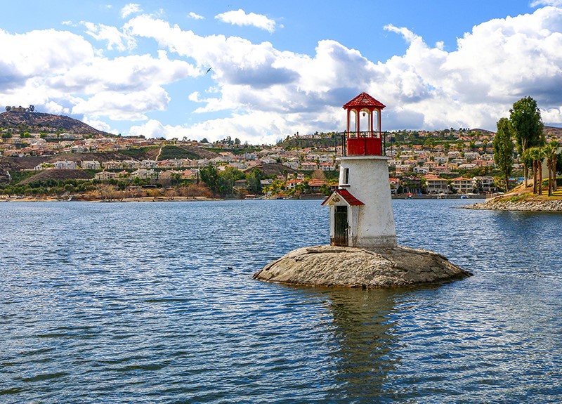 A lighthouse sits on a small island in Canyon Lake.