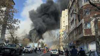 Smoke from an explosion fills the sky in Tehran after an attack by the U.S. military March 3, 2026.