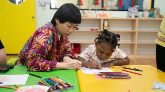 Early childhood education, preschool teacher and student.