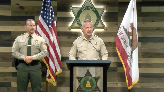 Sheriff Chad Bianco, at podium, with Assistant Sheriff Dave Lelevier, speaks to reporters Friday, March 20 about his election probe.